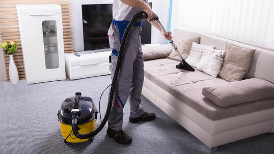 Photo of Fresno Carpet Cleaning technician cleaning a sofa